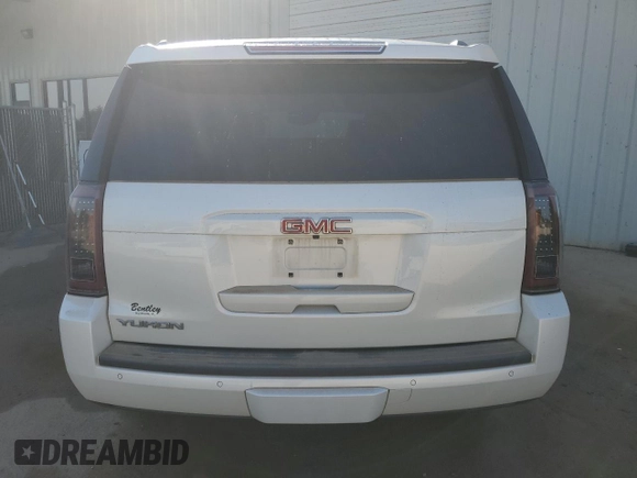 2015 GMC Yukon SLT with VIN 1GKS1BKCXFR563509, listed as a Copart auction lot 77188854 with 127,481 mi miles and Clean Title. Bid and sale history available at carsss.com. Image 6.