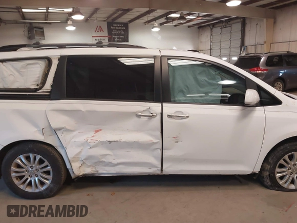 2011 Toyota Sienna XLE AAS with VIN 5TDYK3DC5BS130066, listed as a IAAI auction lot 41294340 with 156,591 mi miles and . Bid and sale history available at DreamBid. Image 13.