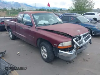 2000 Dodge Dakota Sport z VIN 1B7GL22N7YS528869, wystawiony jako IAAI lot #42180439 z przebiegiem 169 150 mil mil oraz . Historia ofert i sprzedaży dostępna na DreamBid. Obrazek 1.