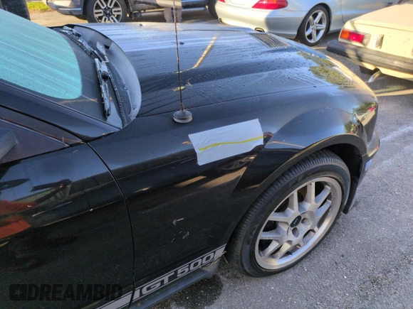 2007 Ford Mustang Shelby GT500 z VIN 1ZVHT88S975325819, wystawiony jako Copart lot #75202244 z przebiegiem Nie podano mil oraz Szkoda całkowita • Salvage title. Historia ofert i sprzedaży dostępna na DreamBid. Obrazek 12.