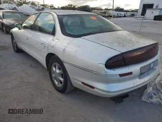1999 Oldsmobile Aurora with VIN 1G3GR62C2X4107973, listed as a Copart auction lot 84023124 with 80,402 mi miles and Non Repairable. Bid and sale history available at DreamBid. Image 2.