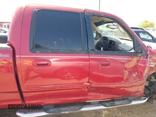 2002 Ford F-150 XLT with VIN 1FTRW07682KC33857, listed as a IAAI auction lot 41870137 with 185,480 mi miles. Bid and sale history available at carsss.com. Image 14.