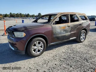 2012 Dodge Durango SXT with VIN 1C4RDHAG9CC180927, listed as a Copart auction lot 74323214 with NaN miles and Salvage Title. Bid and sale history available at carsss.com. Image 1.