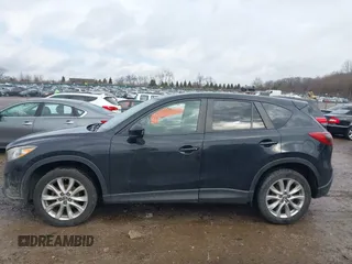 2014 Mazda CX-5 Grand Touring with VIN JM3KE4DY5E0373731, listed as a IAAI auction lot 41517852 with 148,414 mi miles. Bid and sale history available at carsss.com. Image 14.