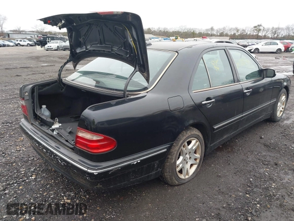 2002 Mercedes-Benz E-Class with VIN WDBJF82J52X064244, listed as a IAAI auction lot 41819863 with 999,999 mi miles. Bid and sale history available at carsss.com. Image 4.
