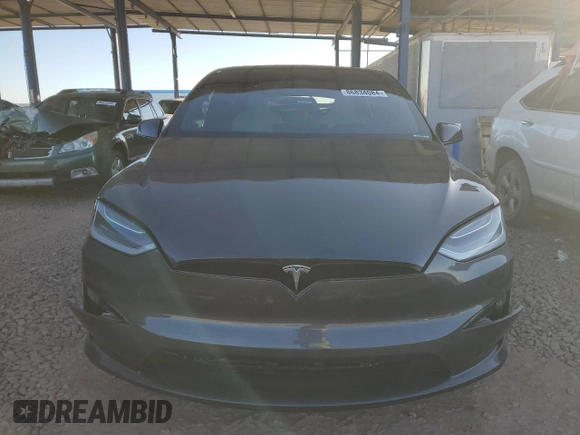 2023 Tesla Model X with VIN 7SAXCAE5XPF384061, listed as a Copart auction lot 86834084 with 6,974 mi miles and Salvage Title. Bid and sale history available at DreamBid. Image 5.