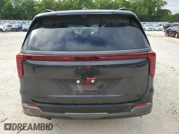2025 Kia Carnival SX with VIN KNDNE5K37S6490478, listed as a Copart auction lot 51389565 with 6,929 mi miles and Salvage Title. Bid and sale history available at DreamBid. Image 6.