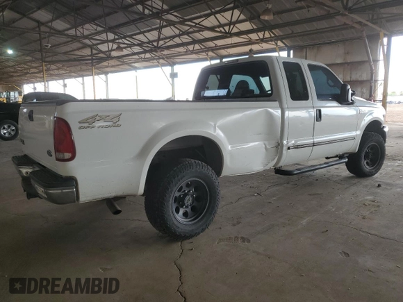 2000 Ford Super Duty F-250 XL with VIN 1FTNX21S9YED03242, listed as a Copart auction lot 74542704 with 218,739 mi miles and Salvage Title. Bid and sale history available at carsss.com. Image 3.