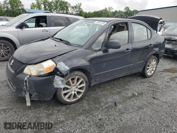 2011 Suzuki SX4 LE z VIN JS2YC5A28B6300625, wystawiony jako Copart lot #54044155 z przebiegiem 179 269 mil mil oraz Szkoda całkowita • Salvage title. Historia ofert i sprzedaży dostępna na DreamBid. Obrazek 1.
