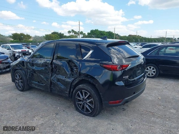 2018 Mazda CX-5 Grand Touring with VIN JM3KFBDM2J0390611, listed as a IAAI auction lot 42006482 with 97,497 mi miles. Bid and sale history available at carsss.com. Image 3.