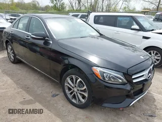 2015 Mercedes-Benz C with VIN 55SWF4KBXFU040013, listed as a IAAI auction lot 42136894 with 123,460 mi miles. Bid and sale history available at carsss.com. Image 1.