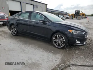 2020 Ford Fusion Titanium with VIN 3FA6P0D90LR192500, listed as a Copart auction lot 53746345 with 135,636 mi miles and Salvage title. Bid and sale history available at DreamBid. Image 4.
