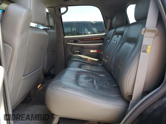 2002 Cadillac Escalade z VIN 1GYEC63T42R189976, wystawiony jako Copart lot #57852565 z przebiegiem 243 089 mil mil oraz Szkody całkowita. Historia ofert i sprzedaży dostępna na DreamBid. Obrazek 11.