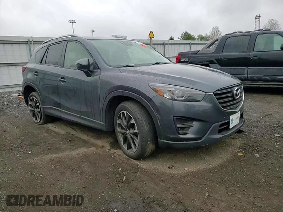 2016 Mazda CX-5 Grand Touring z VIN JM3KE2DY9G0687261, wystawiony jako Copart lot #52865415 z przebiegiem Nie podano mil oraz Szkoda całkowita • Salvage title. Historia ofert i sprzedaży dostępna na DreamBid. Obrazek 12.
