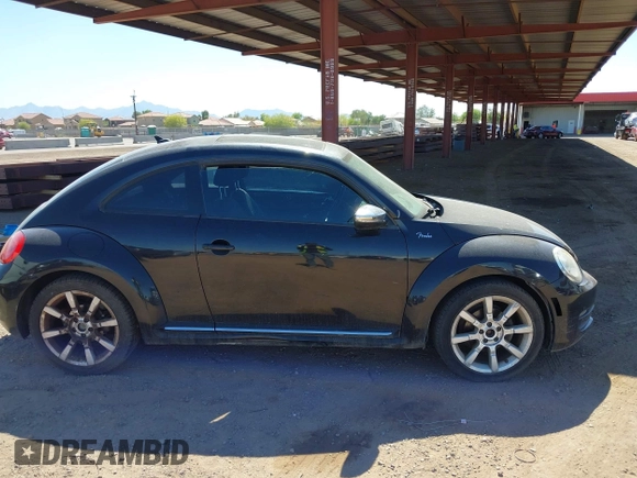 2013 Volkswagen Beetle 2.5L with VIN 3VWJP7ATXDM679115, listed as a IAAI auction lot 42212965 with Not Provided miles and . Bid and sale history available at DreamBid. Image 13.