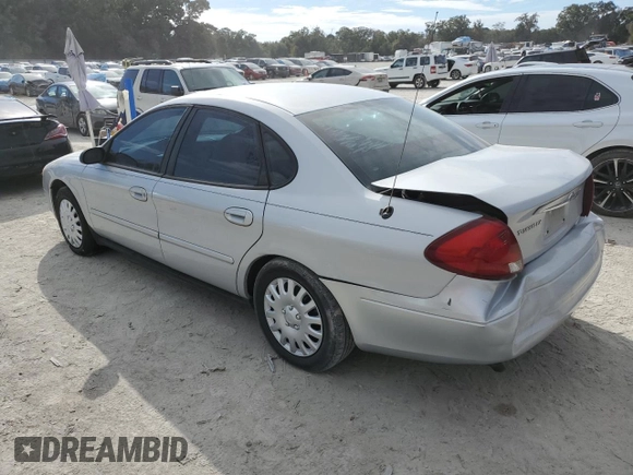 2003 Ford Taurus LX Standard z VIN 1FAFP52U43A110444, wystawiony jako Copart lot #83557764 z przebiegiem 118 897 mil mil oraz Szkoda całkowita • Salvage title. Historia ofert i sprzedaży dostępna na DreamBid. Obrazek 2.