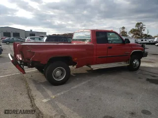 2002 Dodge Ram 3500 with VIN 3B7MF33652M205850, listed as a Copart auction lot 76749504 with 220,734 mi miles and Salvage Title. Bid and sale history available at carsss.com. Image 3.