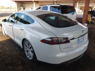 2014 Tesla Model S 60 with VIN 5YJSA1H14EFP63737, listed as a IAAI auction lot 41947610 with 62,240 mi miles and . Bid and sale history available at DreamBid. Image 3.