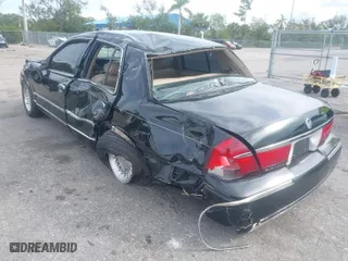 1999 Mercury Grand Marquis LS with VIN 2MEFM75W8XX645350, listed as a IAAI auction lot 40713217 with 56,271 mi miles. Bid and sale history available at carsss.com. Image 3.