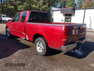 2000 Ford F-150 XL with VIN 1FTRX17L7YKA59717, listed as a IAAI auction lot 40887691 with 104,095 mi miles. Bid and sale history available at carsss.com. Image 3.