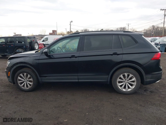 2018 Volkswagen Tiguan S with VIN 3VV1B7AX9JM091210, listed as a IAAI auction lot 41683380 with 63,627 mi miles. Bid and sale history available at carsss.com. Image 14.
