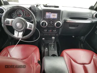 2013 Jeep Wrangler Unlimited Rubicon 10th Anniversary z VIN 1C4HJWFG3DL703331, wystawiony jako Copart lot #70823154 z przebiegiem 148 860 mil mil oraz Szkoda całkowita • Salvage title. Historia ofert i sprzedaży dostępna na DreamBid. Obrazek 8.