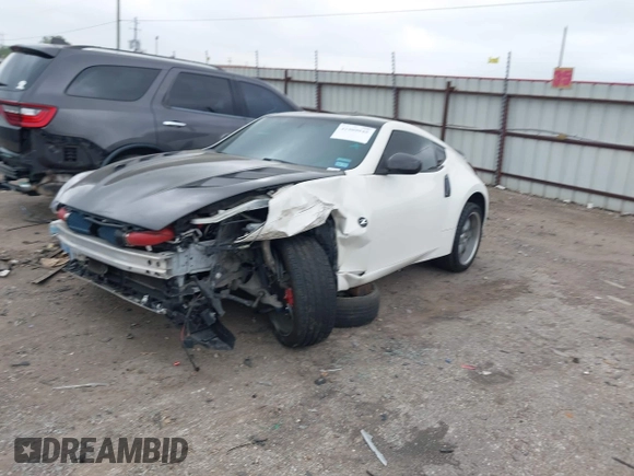 2016 Nissan 370Z Sport z VIN JN1AZ4EH1GM930883, wystawiony jako IAAI lot #41909945 z przebiegiem 80 484 mil mil oraz . Historia ofert i sprzedaży dostępna na DreamBid. Obrazek 2.