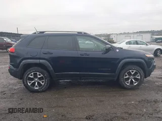 2014 Jeep Cherokee Trailhawk with VIN 1C4PJMBB5EW120432, listed as a IAAI auction lot 41973114 with 88,795 mi miles. Bid and sale history available at carsss.com. Image 13.