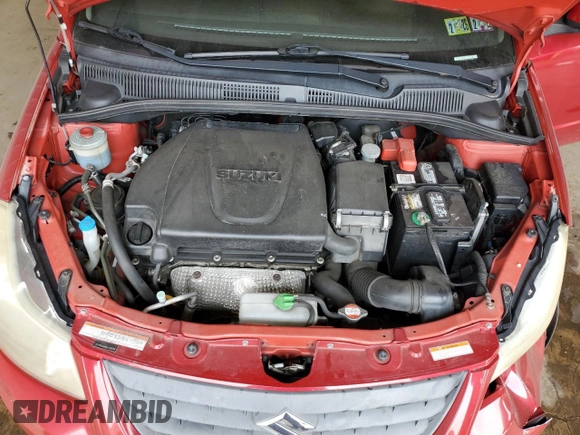 2013 Suzuki SX4 Crossover z VIN JS2YB5A38D6100035, wystawiony jako Copart lot #59970015 z przebiegiem 119 995 mil mil oraz Szkoda całkowita • Salvage title. Historia ofert i sprzedaży dostępna na DreamBid. Obrazek 11.