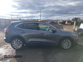 2021 Ford Escape Titanium Hybrid z VIN 1FMCU0DZ0MUB00944, wystawiony jako IAAI lot #41202146 z przebiegiem 52 458 mil mil oraz . Historia ofert i sprzedaży dostępna na DreamBid. Obrazek 13.