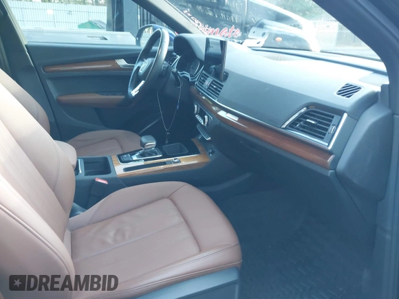 2022 Audi Q5 S line Premium z VIN WA1GAAFY9N2098952, wystawiony jako IAAI lot #40973991 z przebiegiem 29 553 mil mil oraz . Historia ofert i sprzedaży dostępna na DreamBid. Obrazek 5.