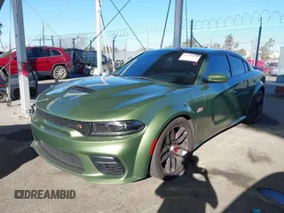 2022 Dodge Charger Scat Pack Widebody with VIN 2C3CDXGJ1NH216763, listed as a IAAI auction lot 41259159 with 32,610 mi miles and . Bid and sale history available at DreamBid. Image 17.