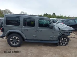 2022 Jeep Wrangler Unlimited Sahara with VIN 1C4HJXEG7NW138105, listed as a IAAI auction lot 42146898 with Not provided miles and . Bid and sale history available at DreamBid. Image 14.