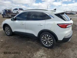 2021 Ford Escape Titanium Hybrid с VIN 1FMCU9DZ5MUA23637, выставлен на аукционе Copart как лот 51991185 с пробегом 101 012 миль миль и Чистый • Clean title. История ставок и продаж доступна на DreamBid. Изображение 2.