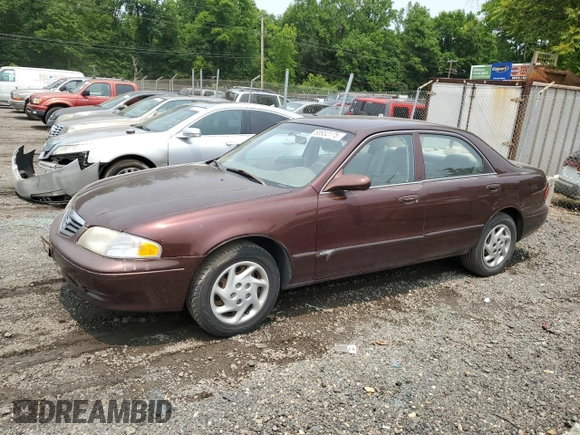 2000 Mazda 626 LX z VIN 1YVGF22C4Y5112874, wystawiony jako Copart lot #58952175 z przebiegiem 100 070 mil mil oraz Szkoda całkowita • Salvage title. Historia ofert i sprzedaży dostępna na DreamBid. Obrazek 1.
