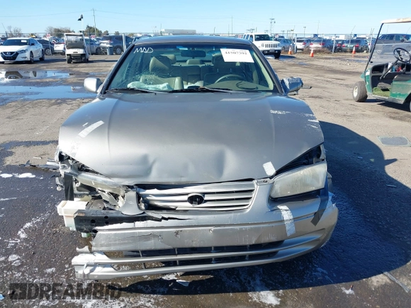 1998 Toyota Camry LE z VIN 4T1BG28KXWU248887, wystawiony jako IAAI lot #41507392 z przebiegiem Nie podano mil oraz . Historia ofert i sprzedaży dostępna na DreamBid. Obrazek 11.