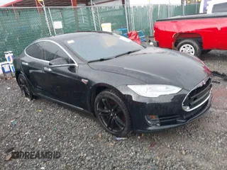2014 Tesla Model S 60 with VIN 5YJSA1H18EFP28053, listed as a IAAI auction lot 41191521 with 82,207 mi miles and . Bid and sale history available at DreamBid. Image 1.