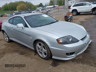 2006 Hyundai Tiburon GT z VIN KMHHN65F56U190508, wystawiony jako IAAI lot #42107641 z przebiegiem 175 496 mil mil oraz . Historia ofert i sprzedaży dostępna na DreamBid. Obrazek 1.
