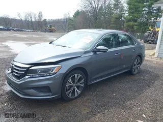 2021 Volkswagen Passat 2.0T SE with VIN 1VWSA7A3XMC011113, listed as a IAAI auction lot 41942881 with 63,753 mi miles. Bid and sale history available at carsss.com. Image 2.
