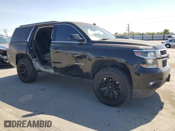 2015 Chevrolet Tahoe LT with VIN 1GNSCBKC2FR115942, listed as a Copart auction lot 54125655 with 132,502 mi miles and Salvage title. Bid and sale history available at DreamBid. Image 4.