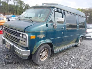 1995 Chevrolet Chevy Van z VIN 1GBEG25K0SF243254, wystawiony jako IAAI lot #41915622 z przebiegiem 74 262 mil mil oraz . Historia ofert i sprzedaży dostępna na DreamBid. Obrazek 2.
