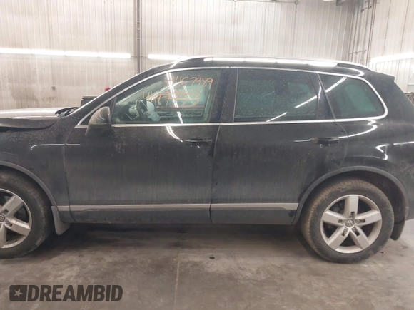 2012 Volkswagen Touareg Sport with VIN WVGEF9BP8CD009511, listed as a IAAI auction lot 41457989 with 87,325 mi miles and . Bid and sale history available at DreamBid. Image 15.