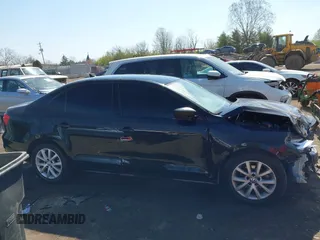 2015 Volkswagen Jetta SE z VIN 3VWD17AJ2FM318882, wystawiony jako IAAI lot #42041914 z przebiegiem 97 623 mil mil oraz . Historia ofert i sprzedaży dostępna na DreamBid. Obrazek 13.