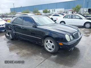 2000 Mercedes-Benz E-Class with VIN WDBJF65JXYA997410, listed as a IAAI auction lot 41939485 with 158,559 mi miles. Bid and sale history available at carsss.com. Image 1.