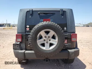 2009 Jeep Wrangler Rubicon with VIN 1J4GA64179L703716, listed as a Copart auction lot 61084215 with 190,262 mi miles and Salvage title. Bid and sale history available at DreamBid. Image 6.