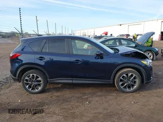 2016 Mazda CX-5 Grand Touring with VIN JM3KE4DY1G0823989, listed as a IAAI auction lot 41770149 with 40,677 mi miles. Bid and sale history available at carsss.com. Image 13.