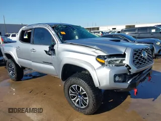 2021 Toyota Tacoma SR z VIN 5TFCZ5ANXMX251261, wystawiony jako IAAI lot #41845324 z przebiegiem 56 093 mil mil oraz . Historia ofert i sprzedaży dostępna na DreamBid. Obrazek 1.