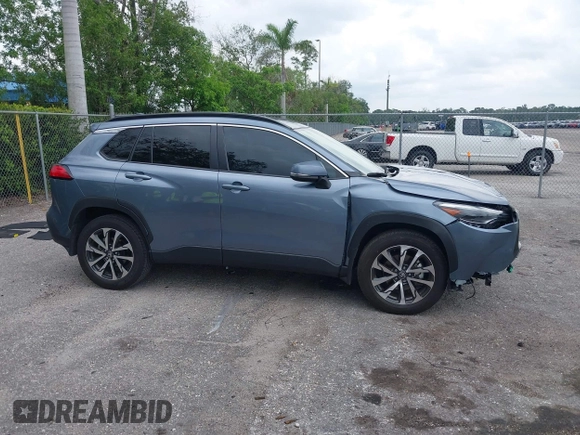 2023 Toyota Corolla Cross XLE with VIN 7MUDAAAGXPV070263, listed as a IAAI auction lot 42394307 with 18,977 mi miles and . Bid and sale history available at DreamBid. Image 14.