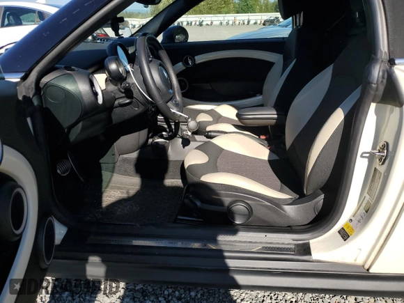 2015 MINI Roadster S z VIN WMWSY3C56FT595466, wystawiony jako Copart lot #69655944 z przebiegiem 53 971 mil mil oraz Szkody całkowita. Historia ofert i sprzedaży dostępna na DreamBid. Obrazek 7.
