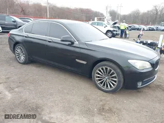 2011 BMW 7 Series 740i with VIN WBAKA4C55BC612584, listed as a IAAI auction lot 42021367 with 139,190 mi miles. Bid and sale history available at carsss.com. Image 1.
